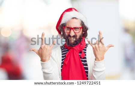 young bearded man christmas concept, wearing a Santa hat 