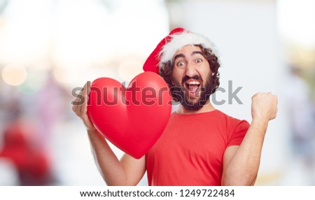 young bearded man christmas concept, wearing a Santa hat 