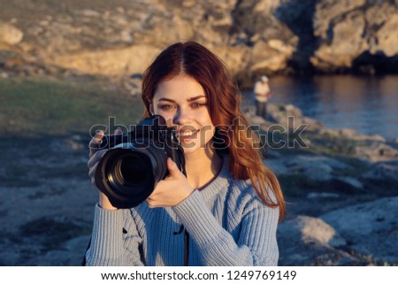 Woman photographer in nature                       