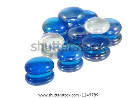 Blue and white glass beads reflected on a mirror. Royalty-Free Stock Photo #1249789