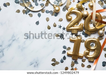 Happy new year 2019 gold background with confetti on a merble background