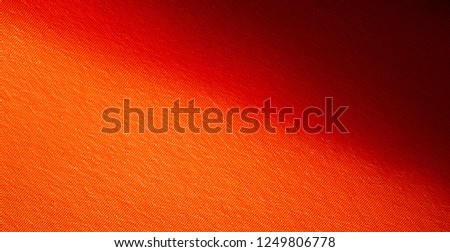 Picture Texture, background Orange silk fabric. It has a wonderful shine with slight color variations to give the look a strip in the fabric. Ideal for adding a touch of luxury to your decor projects