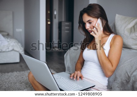 Woman working home on a computer