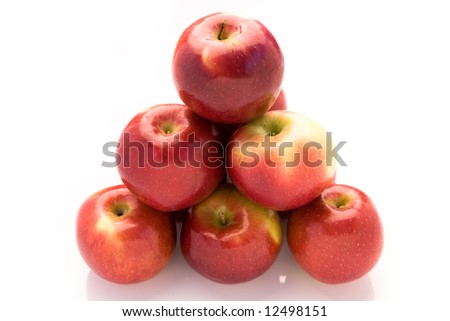 A nice picture of a group of shiny apples in a pyramid shape on a white background