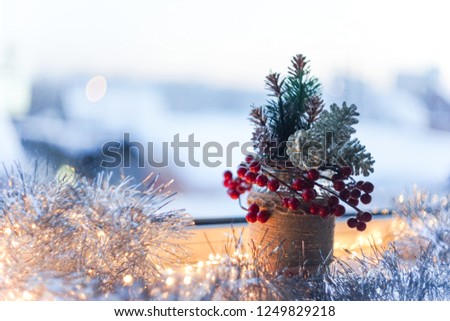 Christmas decorations: lanterns, silver deer, festive background