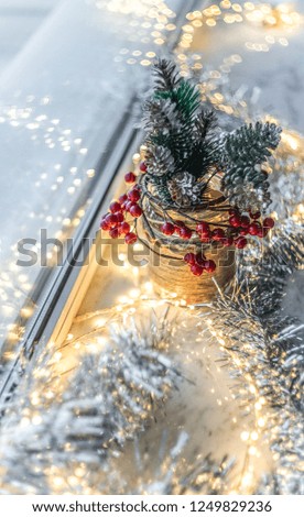 Christmas decorations: lanterns, silver deer, festive background