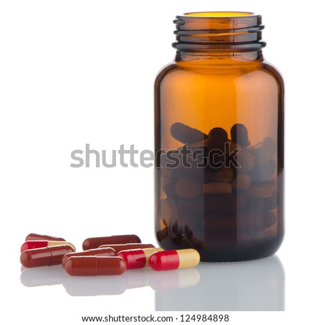 Pills from bottle on the white background.
