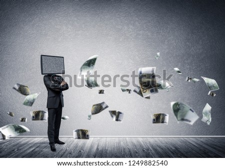 Businessman in suit with TV instead of head keeping arms crossed while standing among flying euro banknotes inside empty room with gray dark wall on background.