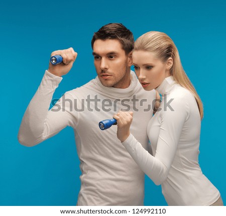 picture of  man and woman with pocket flashlights