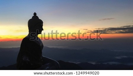 Silhouette Of Buddha Statue On Sunrise Sky Background At Mulayit Mountain Top, Myanmar