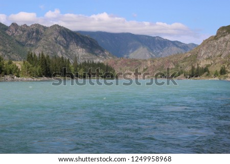 Excellent mountain landscape with the turquoise river "Katun". Russia, Altai Mountains. Atmospheric juicy summer and Russian nature