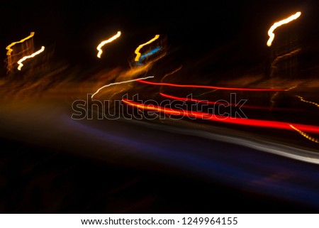 Abstract light trails on dark background / tail lights / motion blur