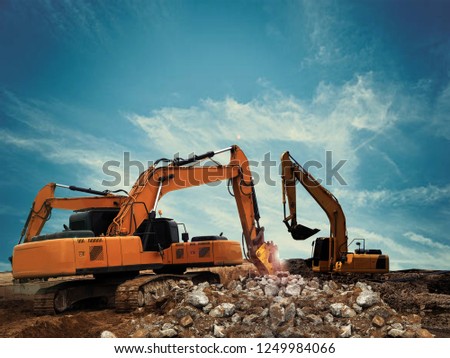 excavator breaker in construction site Royalty-Free Stock Photo #1249984066
