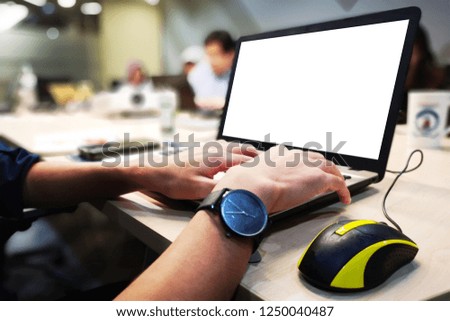 The businessman typing on notebook 
and using mouse , They meeting in the meeting room.