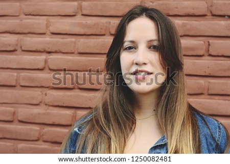 Portrait of young beautiful woman outdoors. Urban concept.
