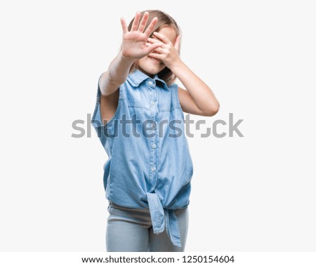 Young beautiful girl over isolated background covering eyes with hands and doing stop gesture with sad and fear expression. Embarrassed and negative concept.