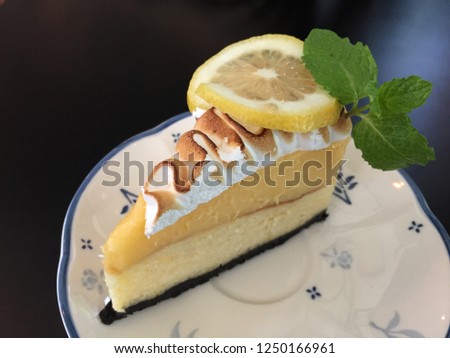 a piece of lemon cheese cake on white dish.