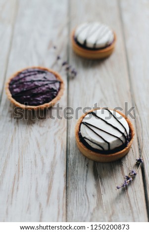 raspberry and lavender tart with meringue and chocolate decor
