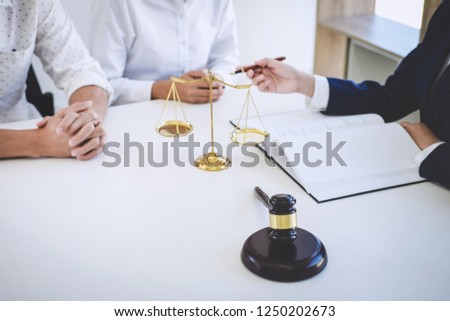Teamwork of business lawyer colleagues, Having meeting with team at law firm, Consultation and conference between a female lawyer and customer tax and contract the company of real estate concept.