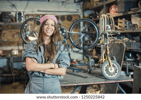 portrait of a young woman worker in a workshop