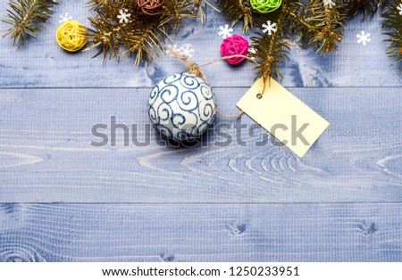Get ready for christmas. Christmas decorations wooden background top view. Tips for preparing christmas in advance. Decorative ball toy and gift tag copy space. Winter and christmas holidays concept.