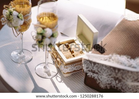 Wedding ceremony. Wedding glasses with champagne. Wedding ring.