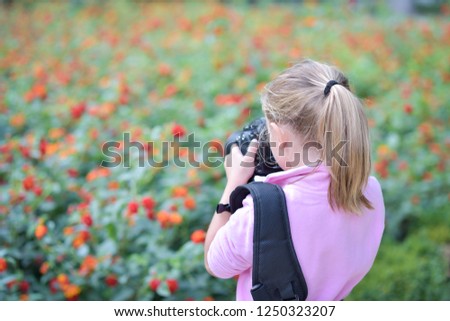 Little girl taking a nature picture