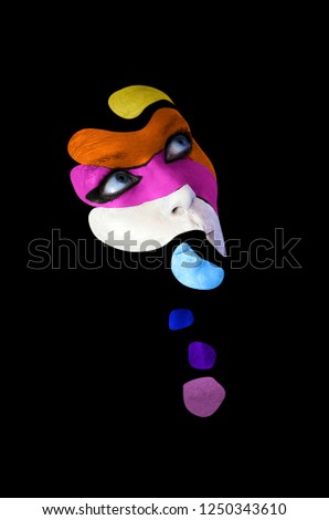 Creative body art. Conceptual idea of colorful makeup. Abstract picture isolated on black background on woman face.