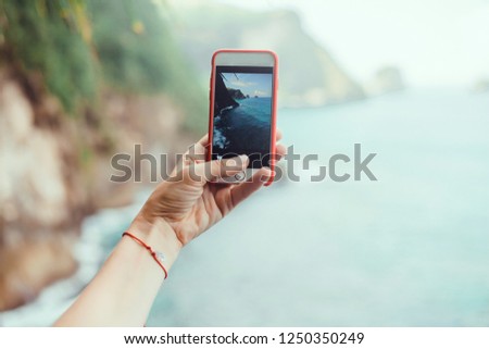 Woman make photo on smartphone, using phone in hand, travel blogger, amazing background, island nature, cell, video, Close up of women's hands holding cell telephone with blank copy space screen
