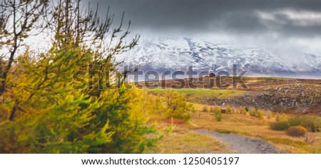 High Icelandic or Scottish mountain landscape with high peaks and dramatic colors