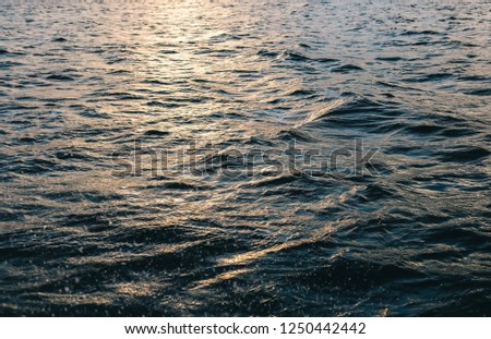 sea ​​waves texture at sunset
