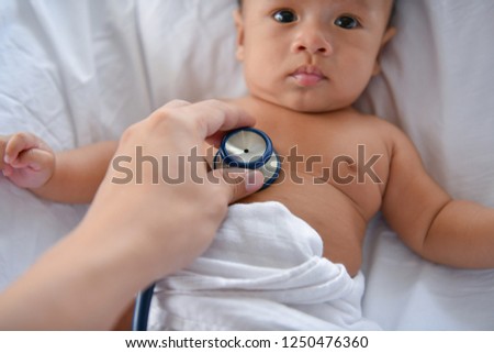 Baby sick concept. The doctor is examining the baby's illness. Babies are not comfortable in the hospital.