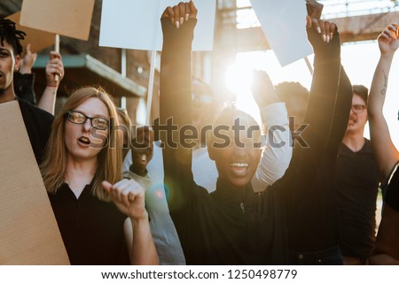 Protesters fighting for their rights Royalty-Free Stock Photo #1250498779