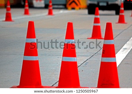 Plastic road cone on the road