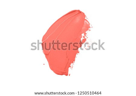 Trend photography on the theme of the actual colors for this season - a shade of orange. Bright smear of foundation in the form of a group of diagonal strokes isolated on a white background. Royalty-Free Stock Photo #1250510464