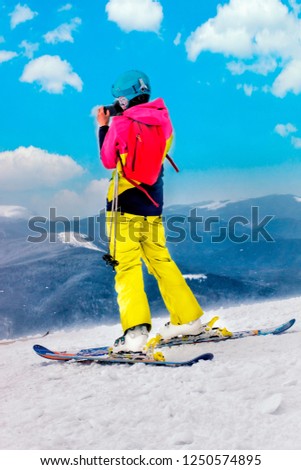 Young girl with smartphone mountain winter resort