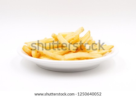 Freshly fried fries 
 Royalty-Free Stock Photo #1250640052
