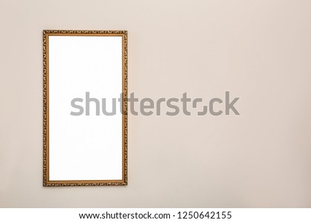 Frame with empty canvas on wall in modern art gallery. Mockup for design