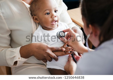 Baby visit to the doctor Royalty-Free Stock Photo #1250646838