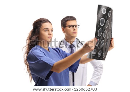 Nurse and a doctor examining an x-ray scan isolated on white background
