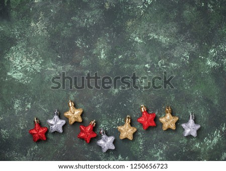 Christmas background with shiny glitter stars. Top view