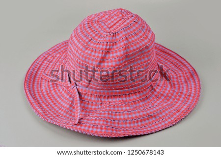 Women`s hat on a white isolated background. Women's beach hat, colorful hat.