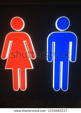 Blue male and red women restroom sign