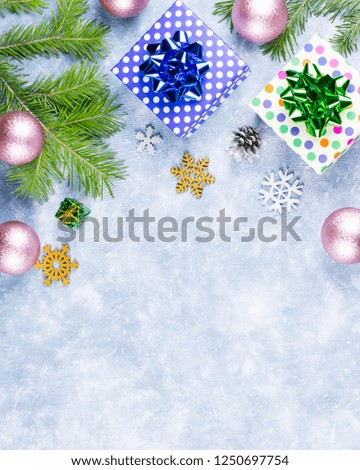 Festive Christmas background with fir branches, Christmas symbols, presents, colorful decorations, copy space