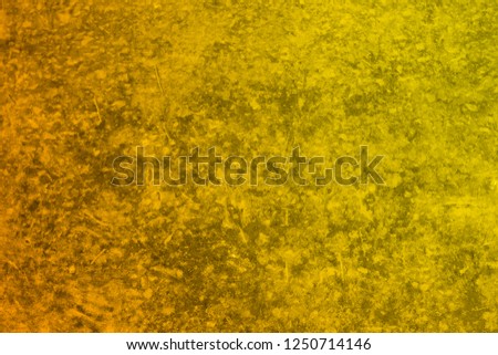Vintage texture of yellow-orange wall for designer background. Concrete painted wall. Illuminated surface. Bright background. Raster image.