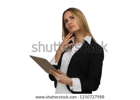 Businesswoman using a tablet and is looking thoughtful