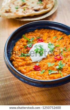 Red Lentil, Coconut Cream and Lime Dal Dhal Daal Curry. Plant Based, vegan, vegetarian, oriental recipe. prepared with fresh onion, carrot, garlic, ginger, mustard seeds, cumin seeds, lime juice.