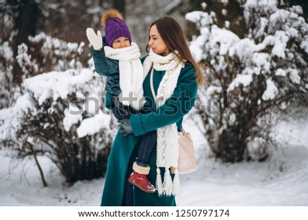 Mother and daughter in winter park
