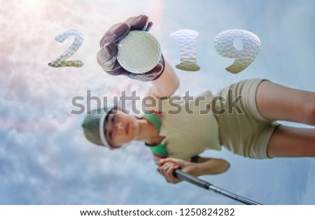 incoming year 2019, prepare by hand of woman golfer on the green,  successfully on occusion of Happy new year and merry Christmas on golf course