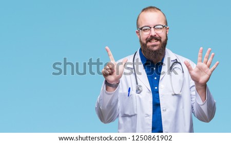 Young caucasian doctor man wearing medical white coat over isolated background showing and pointing up with fingers number seven while smiling confident and happy.